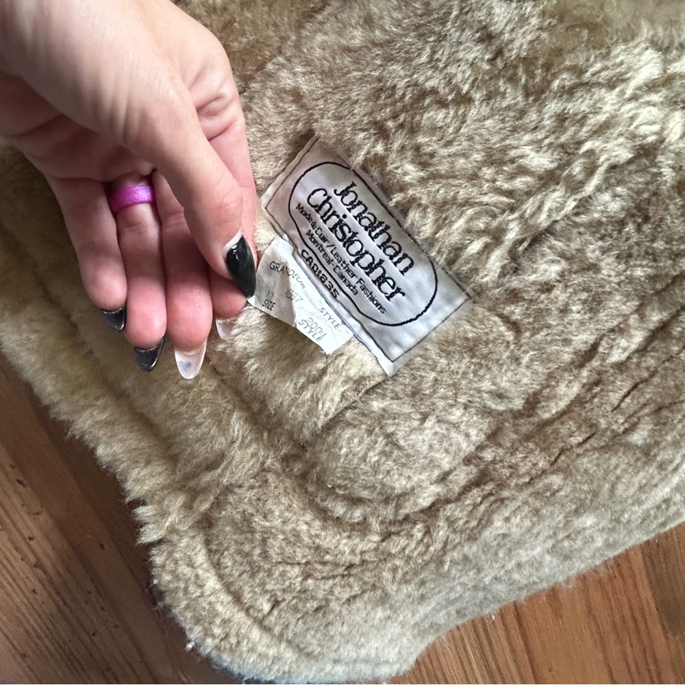 fur jackets brown / creamy size medium/ large brand is Jonathan Christopher